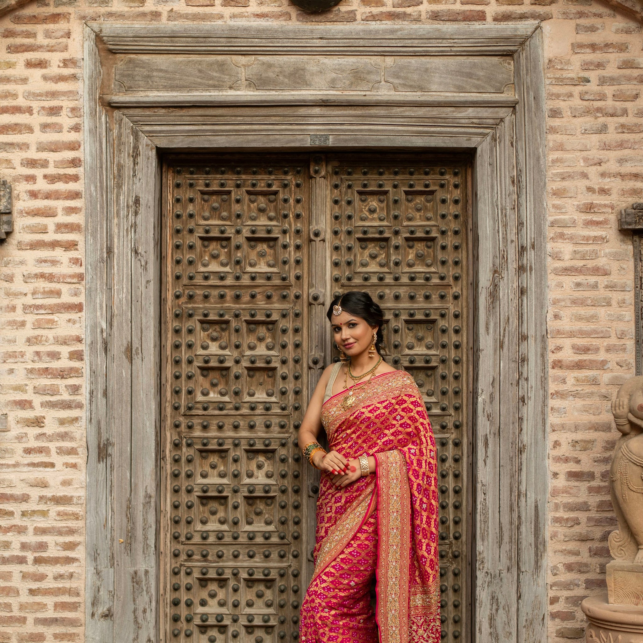 Radiant Banarasi Georgette Bandhani Gharchola Saree with Exquisite Hand Embroidery