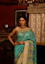 Nityashri (Turquoise Meenakshi Kora Saree)